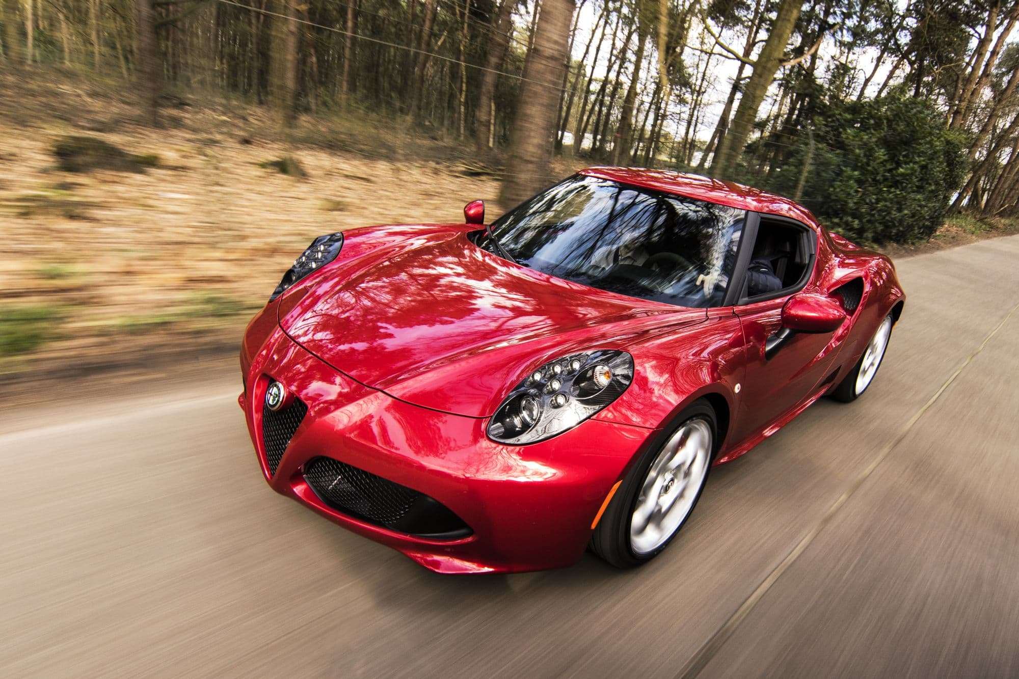 Sports car driving on an open road