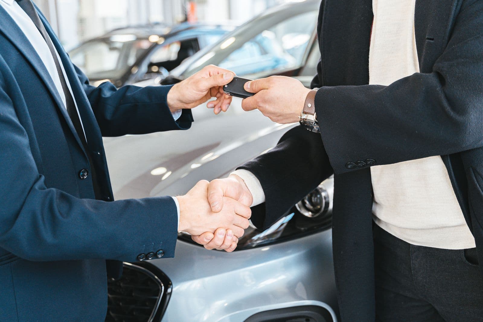 Sales consultant handing over keys